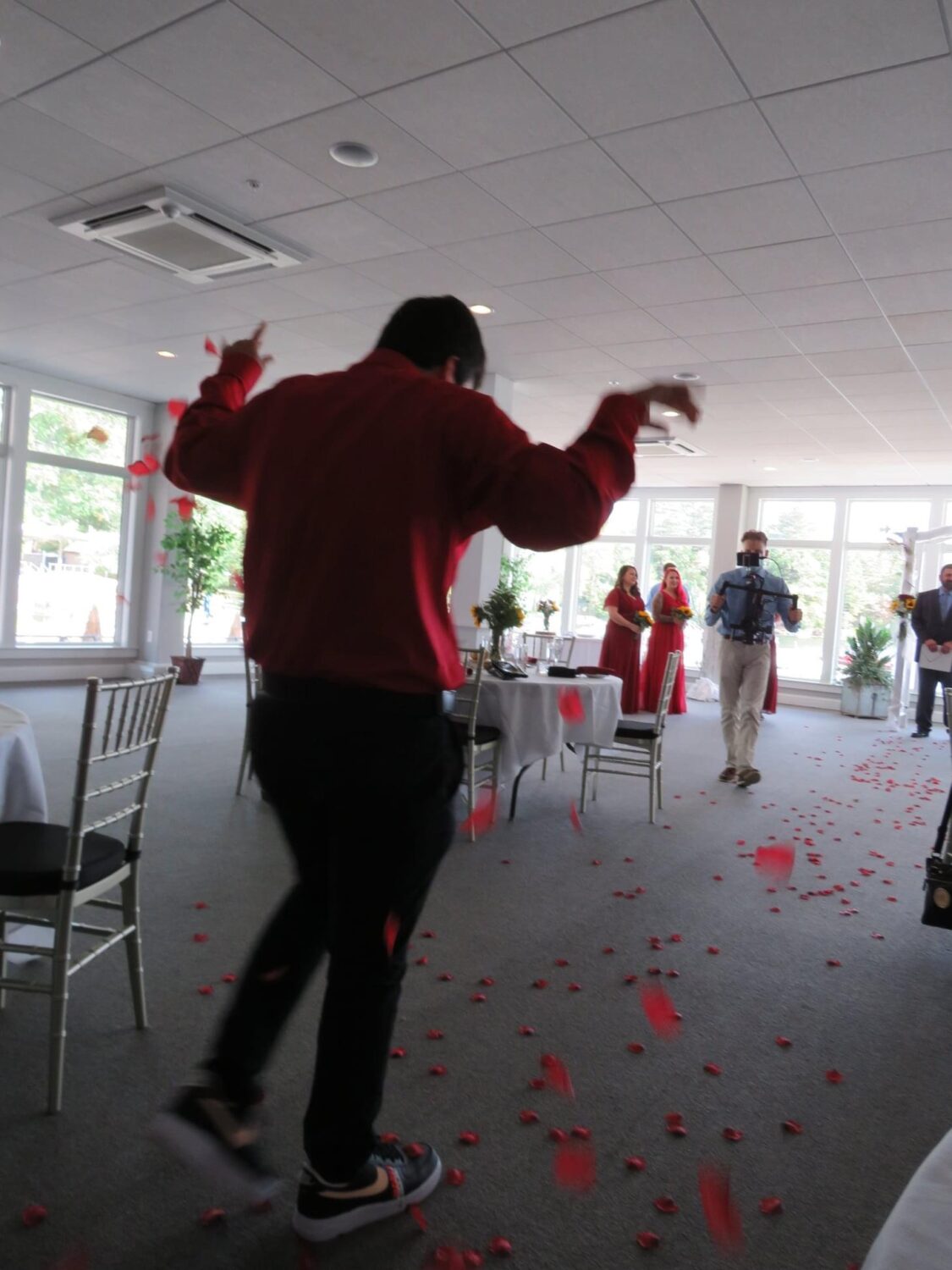 Capturing video at a wedding, this moment was filming the flower boy drop rose pedals on the floor.
